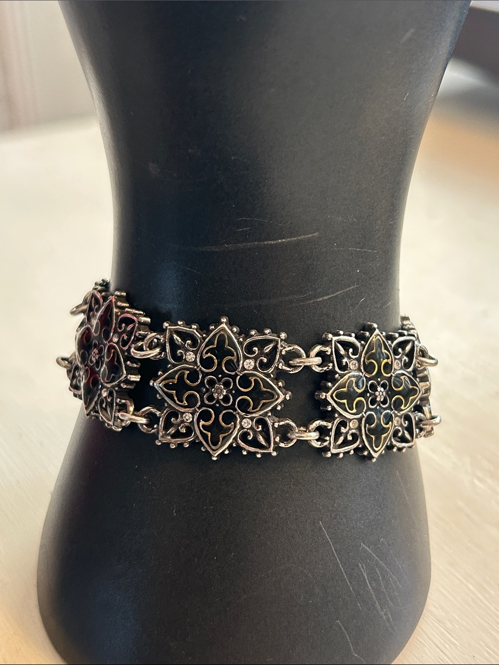 Vintage Brighton bracelet black enamel flower motifs, gold scroll/tiny crystals
